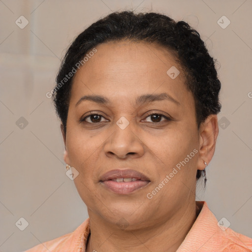 Joyful latino adult female with short  brown hair and brown eyes