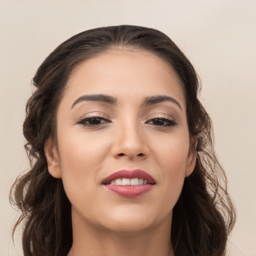 Joyful white young-adult female with long  brown hair and brown eyes