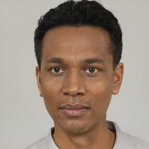 Neutral black adult male with short  black hair and brown eyes