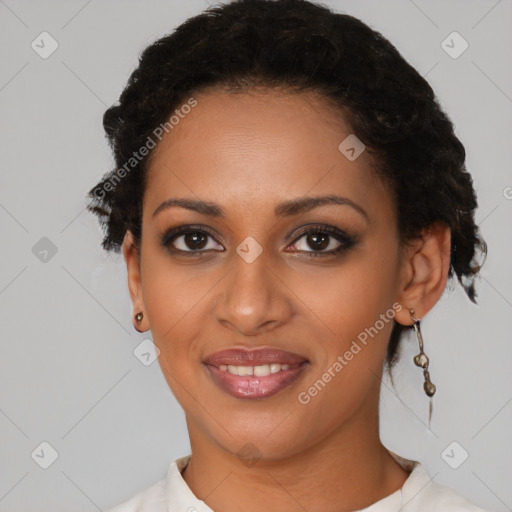 Joyful black young-adult female with short  brown hair and brown eyes