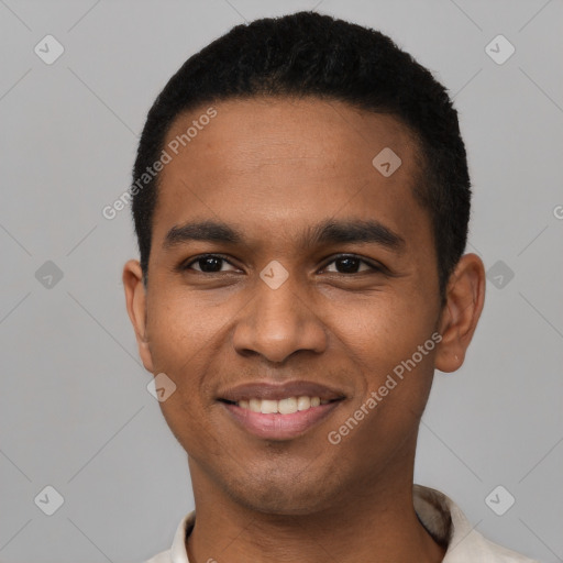 Joyful black young-adult male with short  black hair and brown eyes