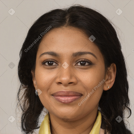 Joyful black adult female with medium  brown hair and brown eyes