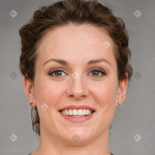 Joyful white young-adult female with medium  brown hair and blue eyes