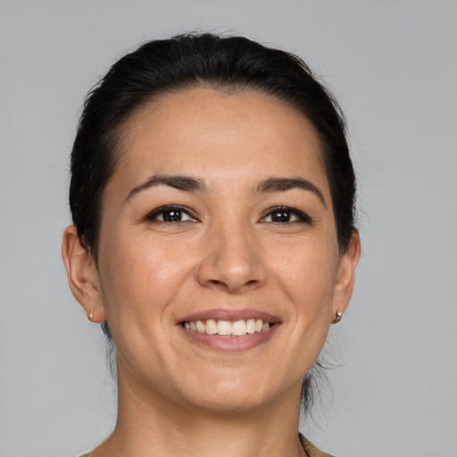 Joyful white young-adult female with medium  brown hair and brown eyes