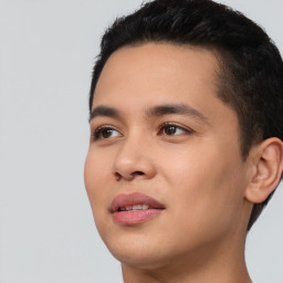 Joyful latino young-adult male with short  black hair and brown eyes