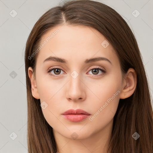 Neutral white young-adult female with long  brown hair and brown eyes