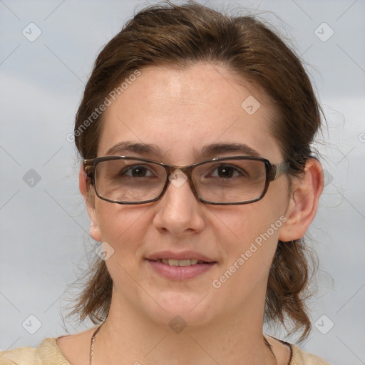 Joyful white adult female with medium  brown hair and grey eyes