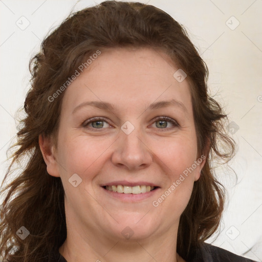 Joyful white adult female with medium  brown hair and grey eyes