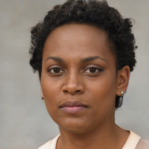 Neutral black young-adult female with short  brown hair and brown eyes