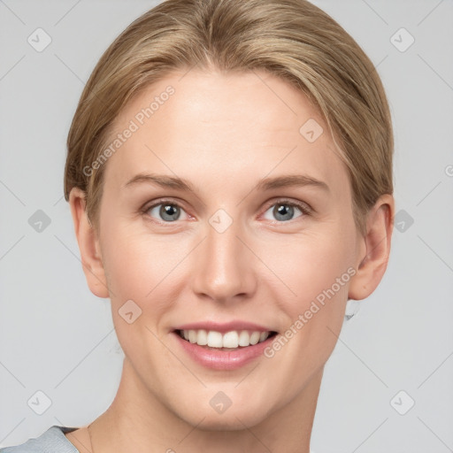 Joyful white young-adult female with short  brown hair and grey eyes