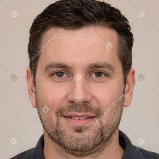 Joyful white adult male with short  brown hair and brown eyes