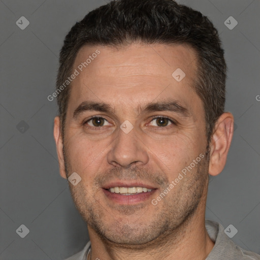 Joyful white adult male with short  brown hair and brown eyes