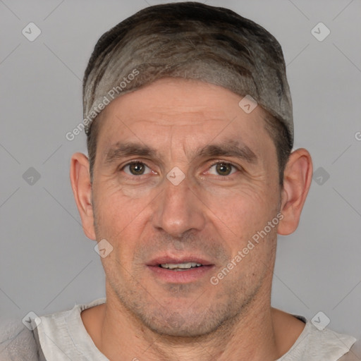 Joyful white adult male with short  brown hair and brown eyes