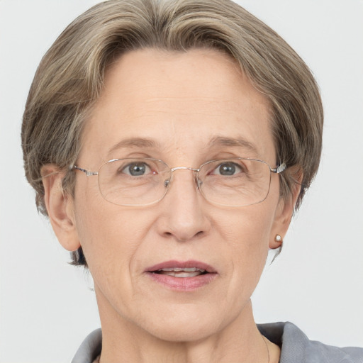 Joyful white middle-aged female with short  brown hair and grey eyes