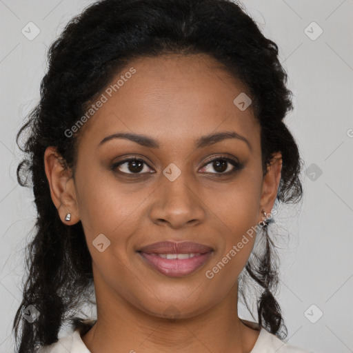 Joyful black young-adult female with long  brown hair and brown eyes