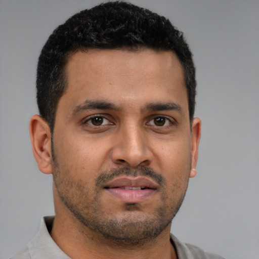 Neutral latino young-adult male with short  brown hair and brown eyes