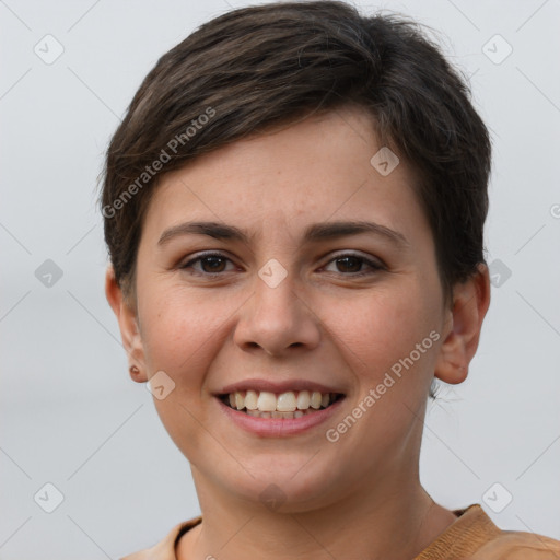 Joyful white young-adult female with short  brown hair and grey eyes