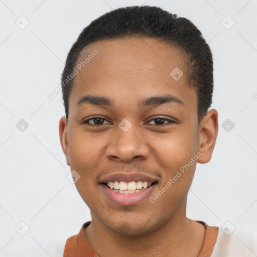 Joyful latino young-adult male with short  brown hair and brown eyes