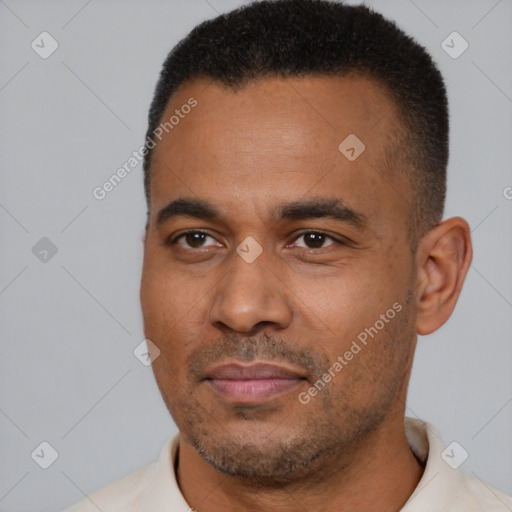 Joyful latino young-adult male with short  brown hair and brown eyes