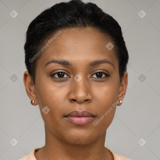 Joyful black young-adult female with short  black hair and brown eyes