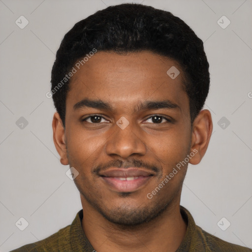 Joyful black young-adult male with short  black hair and brown eyes