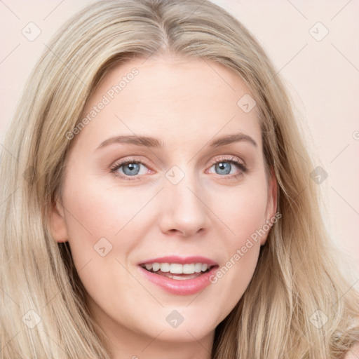 Joyful white young-adult female with long  brown hair and blue eyes