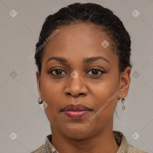 Joyful black adult female with short  black hair and brown eyes