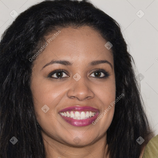 Joyful black young-adult female with long  brown hair and brown eyes