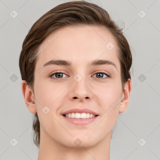 Joyful white young-adult female with short  brown hair and grey eyes