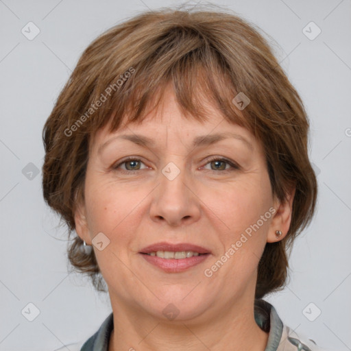 Joyful white adult female with medium  brown hair and grey eyes