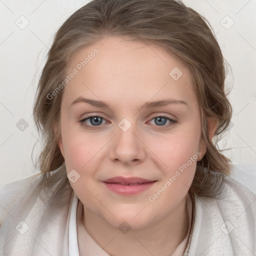 Joyful white young-adult female with medium  brown hair and blue eyes