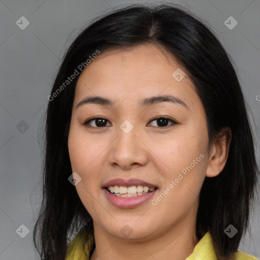 Joyful asian young-adult female with medium  brown hair and brown eyes