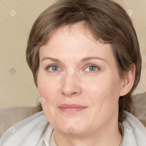 Joyful white adult female with medium  brown hair and blue eyes