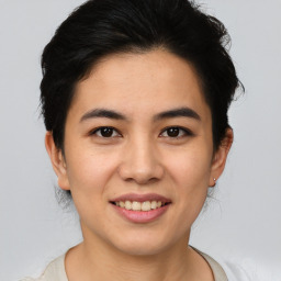 Joyful asian young-adult female with short  brown hair and brown eyes