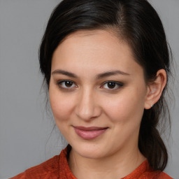 Joyful white young-adult female with medium  brown hair and brown eyes