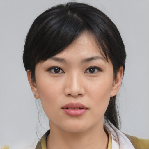 Neutral asian young-adult female with medium  brown hair and brown eyes