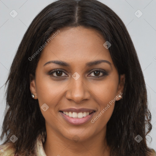 Joyful black young-adult female with long  brown hair and brown eyes