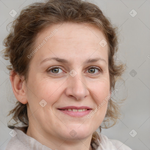 Joyful white adult female with medium  brown hair and blue eyes