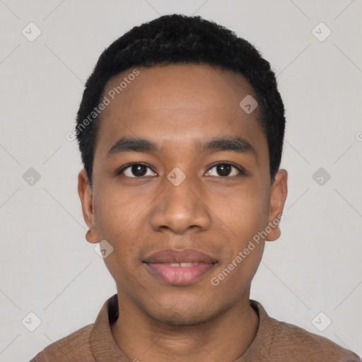 Joyful black young-adult male with short  black hair and brown eyes