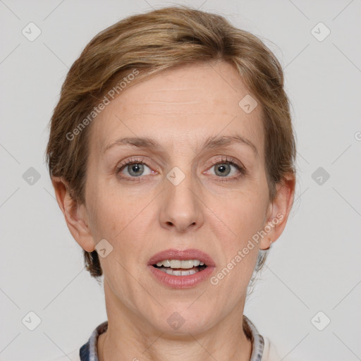 Joyful white adult female with medium  brown hair and grey eyes