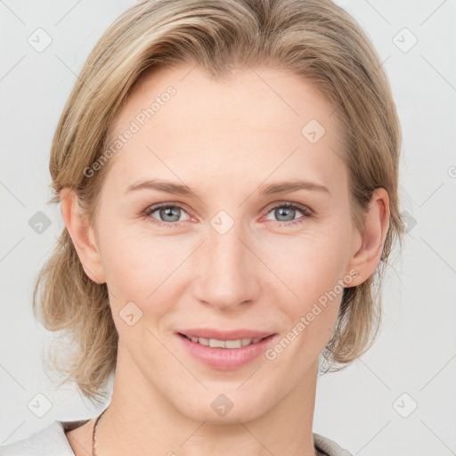 Joyful white young-adult female with medium  brown hair and blue eyes