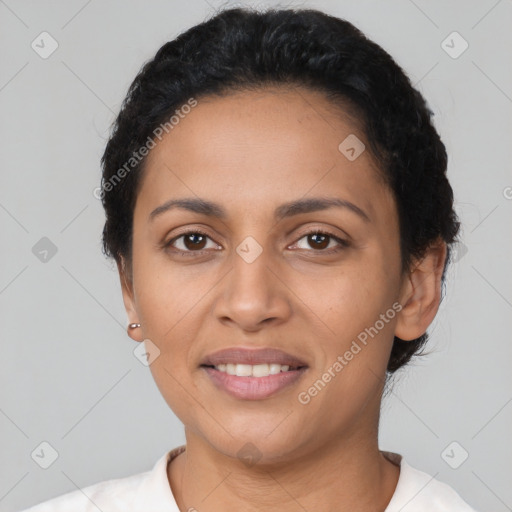 Joyful latino young-adult female with short  black hair and brown eyes