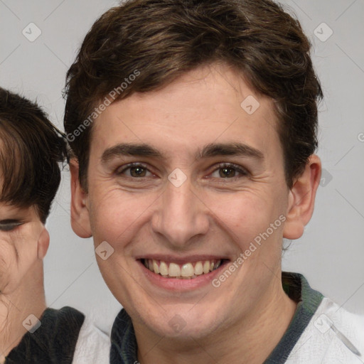 Joyful white adult male with medium  brown hair and brown eyes