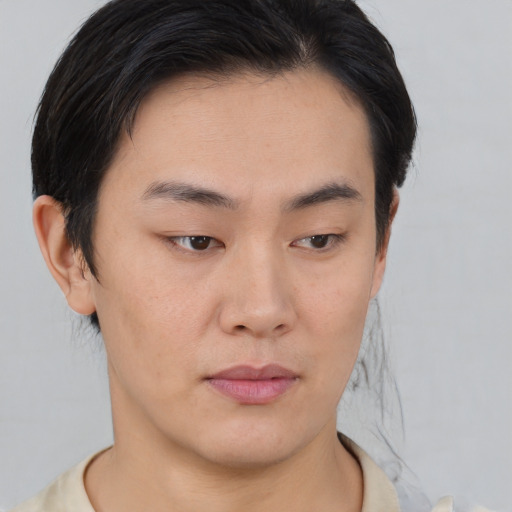 Neutral asian young-adult male with short  brown hair and brown eyes