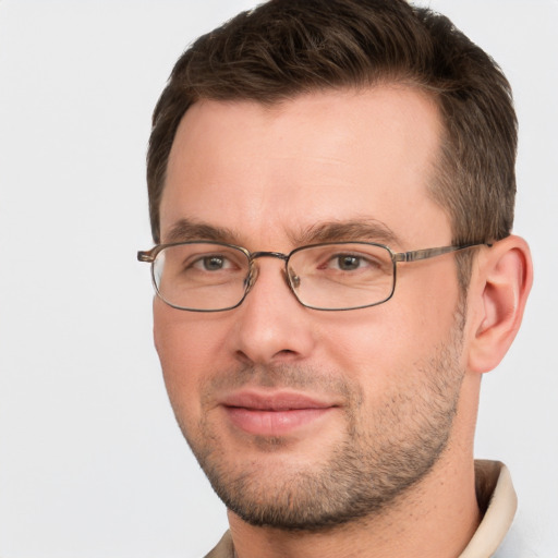 Joyful white adult male with short  brown hair and brown eyes