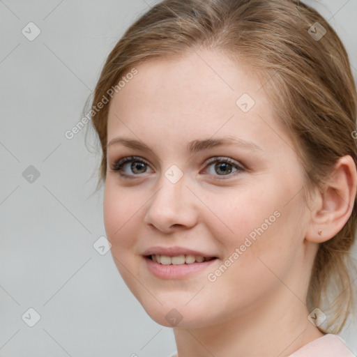 Joyful white young-adult female with medium  brown hair and blue eyes