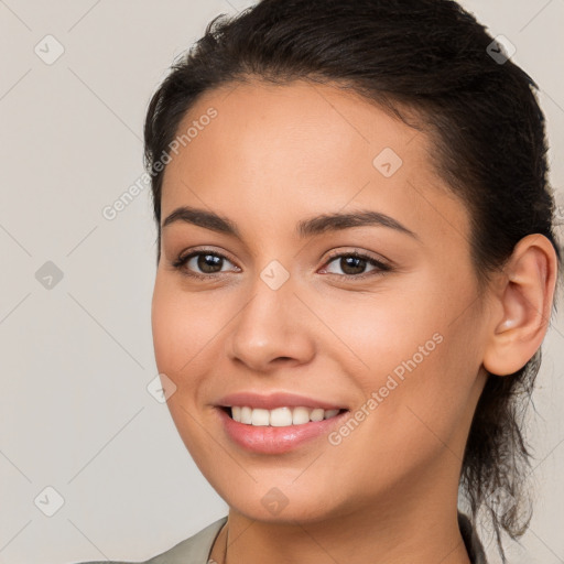 Joyful white young-adult female with long  brown hair and brown eyes