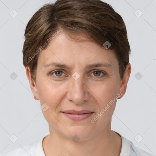 Joyful white adult female with short  brown hair and grey eyes