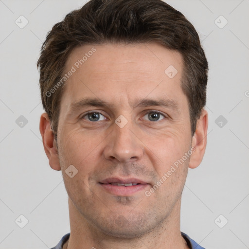 Joyful white adult male with short  brown hair and grey eyes