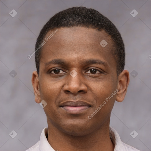 Joyful latino young-adult male with short  brown hair and brown eyes
